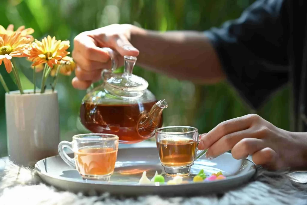 shot-of-young-man-pouring-traditional-tea-from-tra-2023-11-27-05-24-12-utc-2048x1365 - GunHippo